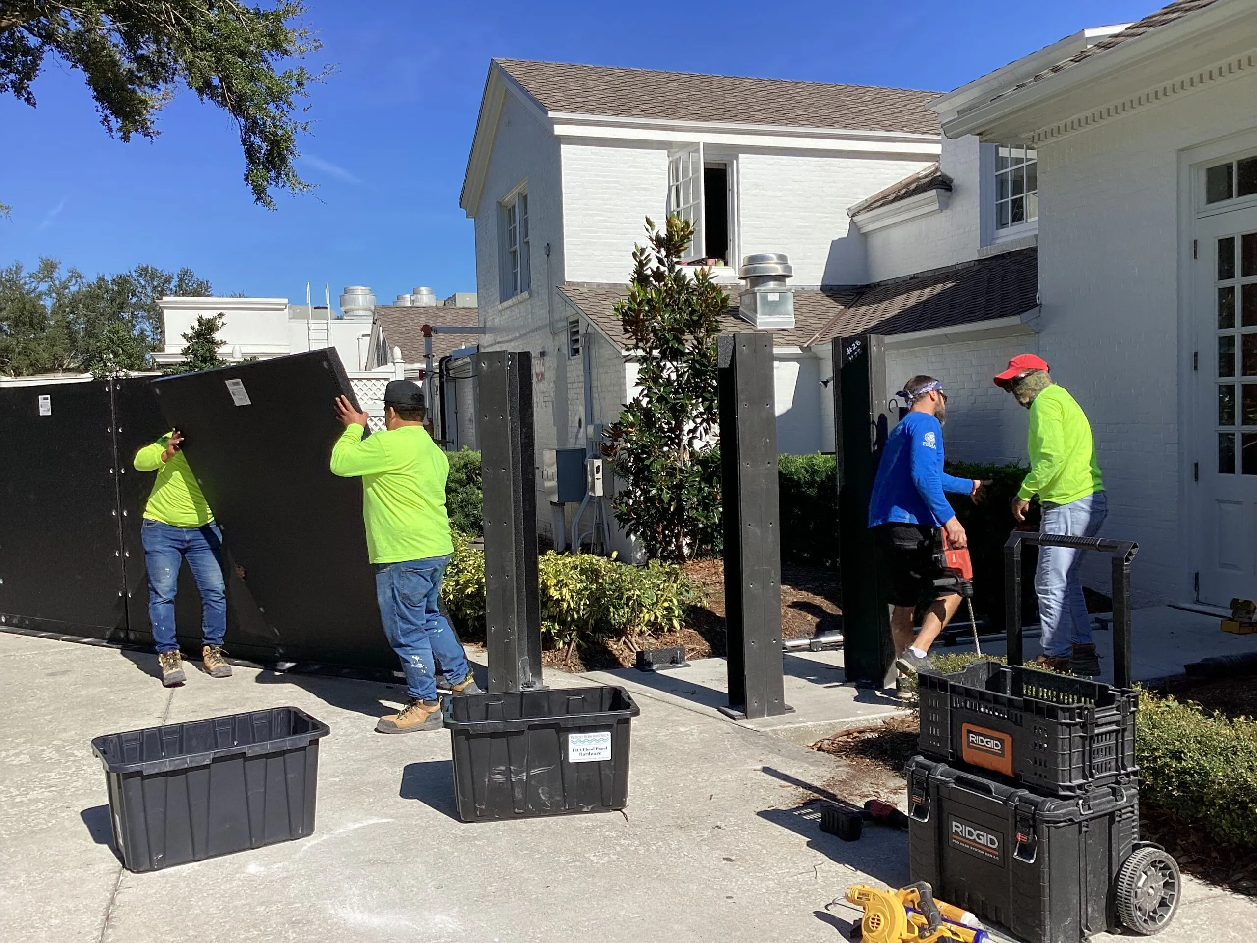 FRA crew installing flood barriers at a residential property